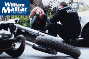 INjured motorcyclist speaking with police