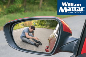 Injured man in rearview mirror after backover accident